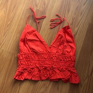 bright red crop top
